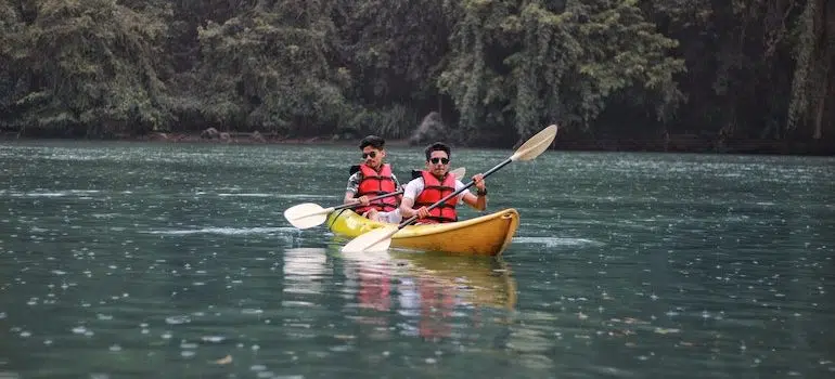 two man in a kayak on water is one of the reasons people move long distance 2021
